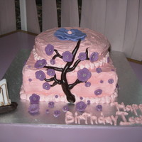 Blossom Cake With Purple Flowers This cake was inspired by all the cherry blossom cakes on here. I made purple flowers though. Thank you for posting all you beautiful cakes...