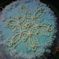 Snowflake Cake 8- inch double layer-Yellow Almond Cake, with Almond and Vanilla Blue Pastel Buttercream. White Chocolate Snowflake and coconut. Made this...