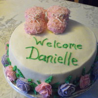 Baby Booties All butter cream icing. The booties are made from cupcakes. Two whole cupcake then two halves to make the toes and sprinkled with coconut...