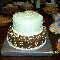 Brown And Green 2 Tier Baby Shower Cake Buttercream iced caked with mint green and brown colors.