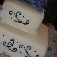 1St Wedding Cake This was my 1st wedding cake. The bottom tier is red velvet cake covered in MMF, the top tier is yellow butter cake covered in MMF. This...