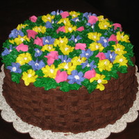 Basket Of Flowers This is a chocolate butter cake with chocolate buttercream icing. This was my 1st attempt at the basket weave. I made this cake for a 93rd...