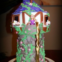 Tangled Tower Cake Over 16" tall - picture doesn't really show that. WASC cake with strawberry cream filling. MM fondant, piping accents. Client...