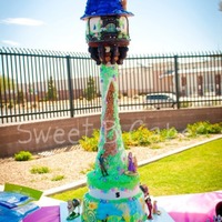 Tangled Cake Bottom tier and house are strawberry with vanilla filling. Second tier is chocolate cake with banana buttercream filling. MM fondant. Tower...