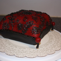 Pillow Pillow cake with hand piped design...
