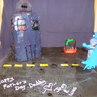 Batman Fathers Day Cake. I made this for a Friend's Husband. Their Oldest son picked the theme. The cake is the building and its just pound cake with vanilla...