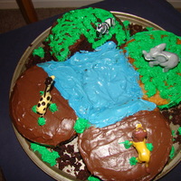 Zoo/jungle Birthday For 4 This was a zoo cake for my kids and their father's nephews, so there were 4 different kids.I used 4 6 inch round cakes all different...