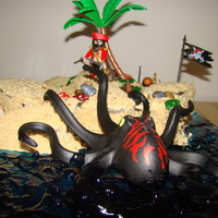Wyatt's Pirate Island This is a pirate Island cake. Vanilla wafers and brown sugar sand. Piping Gel dyed blue for the stormy sea. Pirates are playmobile and part...