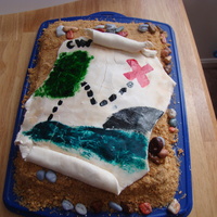 1St Birthday Treasure Map & Vegan Treasure Chest The Treasure map is fondant painted with Wilton colors. The sand is a mix of crushed graham crackers and brown sugar. Chocolate candy rocks...