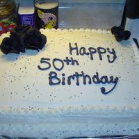 Kathy's 50Th Birthday 1/2 Sheet cake, flowers are silk.