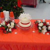 Michelle's Wedding Cake 8 inch and 6 inch white cake with buttercream frosting. Bow is fabric with red ribbon around the bottom. My first offical wedding cake made...