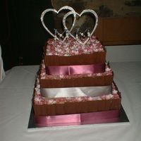 Clare_009.jpg 'Meridee'. 3 tiers of Rich chocolate dessert cake. Decorated in chocolate buttercream and chocolate shards with 100s of handmade...