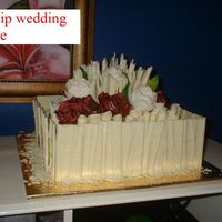 Tulips And Roses 12" Rich Chocolate Dessert Cake covered in white chocolate buttercream and decorated with white chocolate shards and curls and...