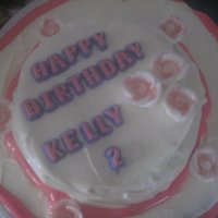 2Nd Birthday Cake this is a top view of kellys 2nd b-day cake. My 1st ever 2 layer cake. The roses and words were bought at walmart. The bottom is chocolate...