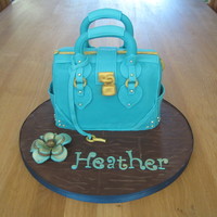 Teal Handbag Cake My first attempt at a handbag cake! Really enjoyed doing it although I desperately need to invest in a proper stitching tool!!