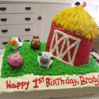 !st Birthday Farm Cake Red Velvet/French Vanilla marble cake with buttercream and toy farm animals.....barn is cake carved on pillars