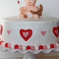 Cupid Cake This was my first attempt at making a fondant/gum paste figure. It turned out pretty well... except my cupid could use a little liposuction...