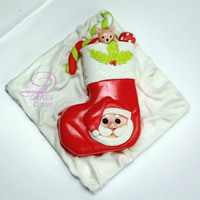 Stocking Christmas Santa Fondant Cake Simple Fondant cake with Stocking Socks Shape and handmade Santa and miscellaneous decoration.