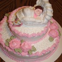 Baby Shower Cake! Saw a picture of a cake similar to this one in a older Wilton book. Loved it and decided to try it! Made this to go with three sheetcakes...