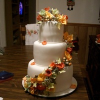 Fall Themed Wedding Cake Fondant covered cake covered in gum paste roses, hydrangeas, calla lilies, ivy leaves and rose buds. *Update - I got 1st place!