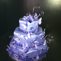 Purple Butterflies My daughter wanted a purple cake with purple butterflies for her birthday. This is what we came up with.