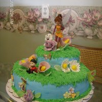 Fairy Baby Shower Cake Buttercream, with fondant flowers, and butterflies. Dog and doll are plastic