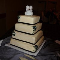 Precious Moments 4 Tier White chocolate cake, fresh rasperry and dark chocolate ganache filling with white chocolate buttercream