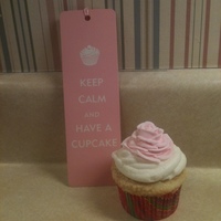 Good Advice A vanilla cupcake with caramel filling topped with vanilla buttercream alongside my favorite bookmark!