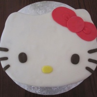 Hello Kitty Cake. I baked a quarter sheet cake, carved the face out, filled and masked with buttercream, and covered in homemade fondant. (I messed up on the...