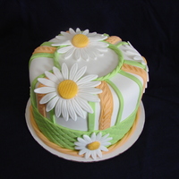 Daisy Fondant Daisy cake. My 2nd fondant cake, playing around with different tools.Yellow cake with buttercream and covered in fondant