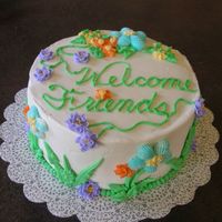 Welcome I was asked to do this cake on the spur of the moment. I went with the flower theme as it seemed cheerful to me. The cake is a yellow cake...