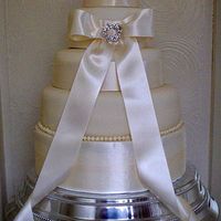 Elegance Three tier wedding cake with Ivory ribbon and jewelled brooch