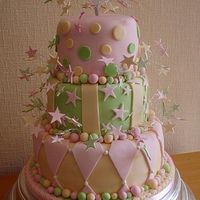Harlequin Wedding Cake Three tier wedding cake in pastel colours and the harlequin design with hand made starbursts