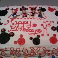 Mickey Mouse Birthday Cake buttercream icing w/fondant mickey heads and plastic figurines