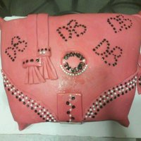 Dooney And Burke Cake fondant. used black food coloring and a toothpic for design.