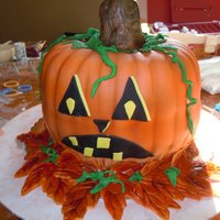 Jack-O-Lantern I made this cake for a Halloween party. It was a pumpkin flavored cake with a cinnamon cream cheese frosting. The stem was made out of RKT...