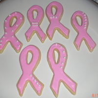 Breast Cancer Ribbons Pink ribbon cookies decorated in royal icing and sugar pearls.