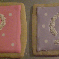 White Chocolate Monogrammed Cookies Monogrammed Cookies. Monograms made with white chocolate and non-pareils. Background of cookie is royal icing.
