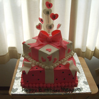 Pink Packages Wrapped Up In Bows And Ribbon I made this for a girl's 18th birthday party....the cake is iced with buttercream and decorated with fondant ribbons, bows, hearts and...