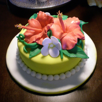 Tropical 30Th Anniversary Cake This is my third fondant cake and my first time working with gumpaste flowers. I think the Hibiscus flowers turned out pretty great! Happy...