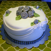 Silver And White 25Th Anniversary Cake This cake was a modern interpretation of the top tier of the couple's original wedding cake from 25 years ago done in silver and white...