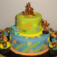 Scooby-Doo Cake Scooby-doo cake with cupcakes to match. The cake was a white cake with a cinnamon sugar buttercream and the cupcakes were chocolate cake...