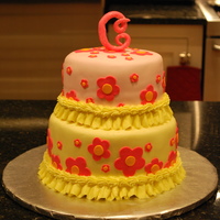 Simply Flowers Two tiered cake covered in fondant