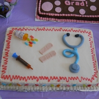 End Of Chemo/medical Supplies Cake I made this for my sister's end of chemo party. Fondant stethoscope and bandaids.