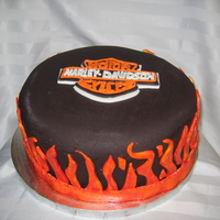 Harley Davidson Yellow and Devil's food cake with a fudge icing.I was asked to make this cake for a bridal shower a friend was going to. I never...