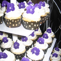 Simple, But Beautiful! Yellow cake with a vanilla buttercream icing and royal icing flowers.A friend was getting married and told me that she did not want a cake...
