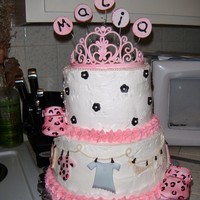 Pink Baby Shower Cake! two tier chocolate cake pink bavarian cream and vanilla buttercream frosting! tiara and shoes and letters are made of gumpaste and the baby...