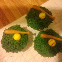 Softball Cupcakes chocolate cupcakes with cream filling and a vanilla buttercream grass. bat and ball r fondant