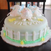 Welcome Baby A welcome cake for my new grandson Trevor. Cake is covered with mmf. Sneakers, lamb, fence and flowers are gum paste.