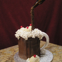 Root Beer Float Made this for my niece. She wanted a root beer cake! I used 5 8" layers with strawberry filling. The ice cream scoops are fondant...